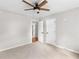 Bedroom featuring neutral walls, carpeted floor, with two doors and ceiling fan at 1605 Mcgarity Rd, Mcdonough, GA 30252