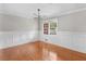 Elegant dining room features wainscoting and hardwood floors at 1605 Mcgarity Rd, Mcdonough, GA 30252