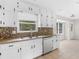 Cozy kitchen featuring stainless appliances, granite counters, and tiled backsplash at 1605 Mcgarity Rd, Mcdonough, GA 30252