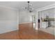 Spacious living room featuring hardwood floors, modern lighting, and neutral paint at 1605 Mcgarity Rd, Mcdonough, GA 30252