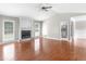 Light-filled living room with a fireplace and hardwood floors at 1605 Mcgarity Rd, Mcdonough, GA 30252