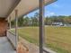 View from a covered porch looking out into the front yard at 1605 Mcgarity Rd, Mcdonough, GA 30252