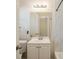 A well-lit bathroom features a modern vanity, white cabinets, and neutral walls at 1932 Rosewood Rd, Decatur, GA 30032