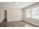 Bedroom featuring hardwood floors and natural light from large windows at 1932 Rosewood Rd, Decatur, GA 30032