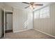 Bright bedroom boasts a ceiling fan, soft carpet, and neutral wall colors for a cozy atmosphere at 1932 Rosewood Rd, Decatur, GA 30032