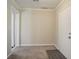 Neutral entryway featuring mixed tile and carpet flooring, with ample natural lighting and a white paneled entry door at 1932 Rosewood Rd, Decatur, GA 30032