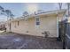 Exterior side view of home highlighting the siding, windows, fenced yard, and gas meter at 1932 Rosewood Rd, Decatur, GA 30032