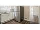 Well-lit kitchen featuring stainless steel refrigerator and a view of a bright adjacent room at 1932 Rosewood Rd, Decatur, GA 30032