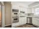 Modern kitchen featuring stainless steel appliances, white cabinets, and sleek countertops at 1932 Rosewood Rd, Decatur, GA 30032