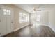 Bright living room with hardwood floors, ceiling fan and plenty of natural light from large windows at 1932 Rosewood Rd, Decatur, GA 30032