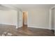 A bright living room features neutral walls and contrasting wood laminate flooring, adding modern charm at 1932 Rosewood Rd, Decatur, GA 30032