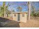 Tan backyard shed with a single door offering additional storage space on the property at 1932 Rosewood Rd, Decatur, GA 30032