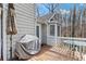 Wooden deck overlooking the wooded backyard is perfect for grilling and entertaining at 67 Oak Landing Way, Douglasville, GA 30134