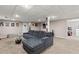 Finished basement offers neutral walls, recessed lighting, a sofa, and a finished laundry area at 67 Oak Landing Way, Douglasville, GA 30134
