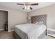 Comfortable bedroom with a large bed, side tables, and stylish ceiling fan at 67 Oak Landing Way, Douglasville, GA 30134