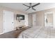 Bedroom featuring a ceiling fan, neutral color walls, and ensuite bathroom at 67 Oak Landing Way, Douglasville, GA 30134