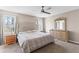 Bright bedroom featuring a fan, large windows, and neutral paint, creating a relaxing atmosphere at 67 Oak Landing Way, Douglasville, GA 30134