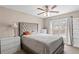 This bedroom features a lux bed, carpet, and a large window with plenty of natural light at 67 Oak Landing Way, Douglasville, GA 30134