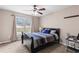 Comfortable bedroom with ample natural light, a ceiling fan, and carpeted flooring at 67 Oak Landing Way, Douglasville, GA 30134