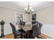 A naturally lit dining area showcases a stylish table and chairs, complemented by modern decor and fixtures at 67 Oak Landing Way, Douglasville, GA 30134