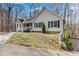 Inviting home with a well-manicured lawn and mature trees surrounding the property at 67 Oak Landing Way, Douglasville, GA 30134