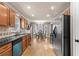 A well-lit kitchen showcases sleek stainless steel appliances and a dining table, set against a backdrop of modern design at 67 Oak Landing Way, Douglasville, GA 30134