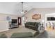 Inviting living room with cozy seating, TV, and easy access to the dining area at 67 Oak Landing Way, Douglasville, GA 30134