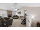 Cozy living room with stone fireplace, neutral walls, and carpet flooring, perfect for relaxation at 67 Oak Landing Way, Douglasville, GA 30134