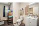 Bathroom with patterned shower curtain, tiled wall, and sink at 69 Polar Rock Sw Rd, Atlanta, GA 30315