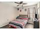 This bedroom has a ceiling fan and a window with blinds and curtains at 69 Polar Rock Sw Rd, Atlanta, GA 30315