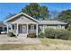 Charming home featuring a covered front porch, manicured landscaping, and classic architectural details at 69 Polar Rock Sw Rd, Atlanta, GA 30315