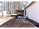 A view of the backyard featuring a covered patio area and exterior of the home and outdoor shed at 975 Fox Valley Trl, Stone Mountain, GA 30088