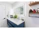 Bathroom with modern vanity, large mirror, and overhead lighting at 975 Fox Valley Trl, Stone Mountain, GA 30088