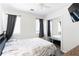 Bedroom with gray floors and mirrored closet door offers great space and natural light at 975 Fox Valley Trl, Stone Mountain, GA 30088