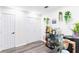 Hallway featuring hardwood floors, plants, and wine rack at 975 Fox Valley Trl, Stone Mountain, GA 30088