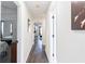 Hallway with dark wood-look floors that leads to the bedroom and living spaces at 975 Fox Valley Trl, Stone Mountain, GA 30088