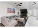 Comfortable living room with a black brick fireplace and a gray sofa with pillows at 975 Fox Valley Trl, Stone Mountain, GA 30088