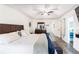 The main bedroom includes a wooden dresser, wooden floors, and a neutral-colored palette at 975 Fox Valley Trl, Stone Mountain, GA 30088