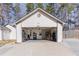 Spacious three car garage with organized shelving units and overhead lighting at 975 Fox Valley Trl, Stone Mountain, GA 30088