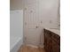 Bathroom features a bathtub and a vanity with marble countertop at 110 Great Oaks Ln, Roswell, GA 30075