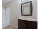 Bathroom featuring vanity with decorative mirror and tiled floors at 110 Great Oaks Ln, Roswell, GA 30075