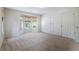 Bedroom with natural light coming in from the windows and double closets at 110 Great Oaks Ln, Roswell, GA 30075