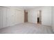 Spacious bedroom with neutral carpet, closet, and ensuite access at 110 Great Oaks Ln, Roswell, GA 30075