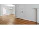 Bright entryway showcasing hardwood floors, white trim, and an open view to the chandelier-lit dining room at 110 Great Oaks Ln, Roswell, GA 30075