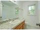 Bathroom featuring granite counter, a toilet, and a bright window at 2811 Bay Leaf Se Dr, Conyers, GA 30094