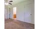 Bedroom featuring neutral carpet, two closets, and a view to bathroom at 2811 Bay Leaf Se Dr, Conyers, GA 30094