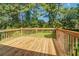 Spacious wooden deck perfect for outdoor entertaining, overlooking a private and green backyard at 2811 Bay Leaf Se Dr, Conyers, GA 30094