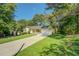 Charming single-story home with well-manicured lawn, extended driveway, and attached two-car garage at 2811 Bay Leaf Se Dr, Conyers, GA 30094