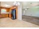 Spacious eat-in kitchen featuring wood cabinets, a refrigerator, and a view into the living area at 2811 Bay Leaf Se Dr, Conyers, GA 30094