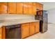 Traditional kitchen featuring wood cabinetry, neutral countertops, and stainless steel refrigerator at 2811 Bay Leaf Se Dr, Conyers, GA 30094